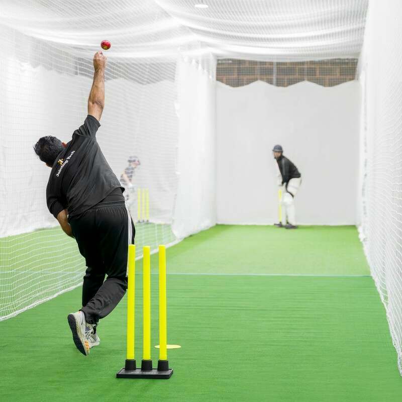 bowler with cricket ball just released from hand